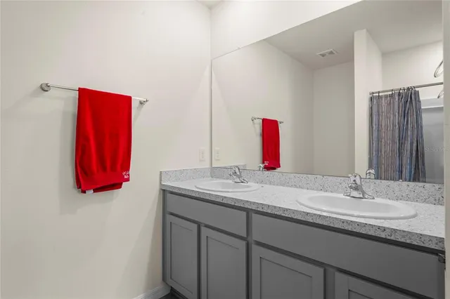 a bathroom with a bathtub and shower