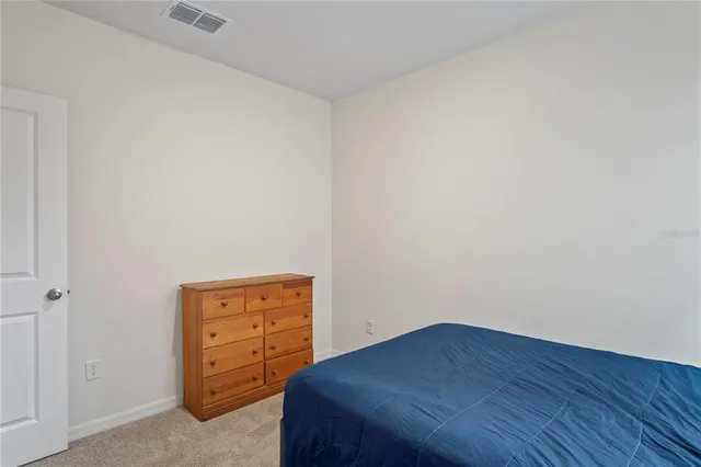 a view of backyard of house with green space