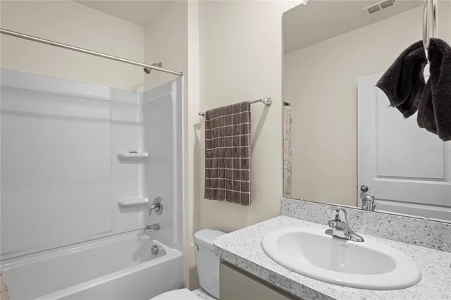 a view of a house with backyard and garden