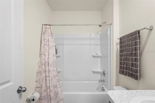 an aerial view of a house with a garden and swimming pool