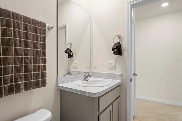 an aerial view of a swimming pool with outdoor seating