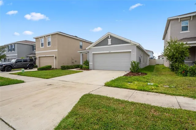 a view of a table and chairs under an umbrella