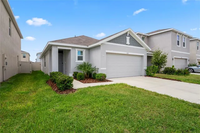 a view of a table and chairs under an umbrella