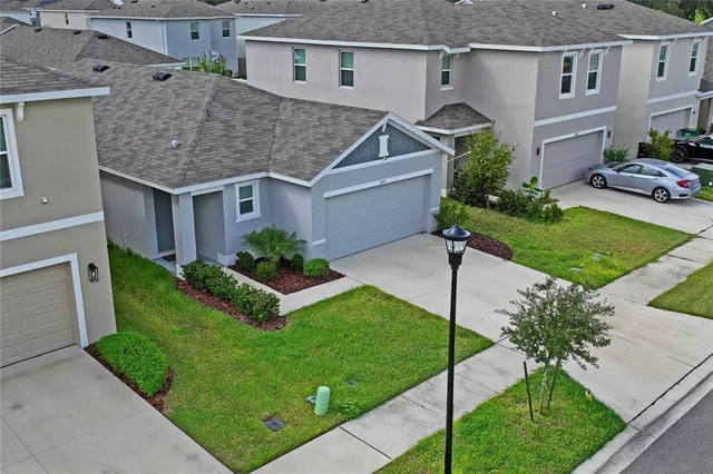 an aerial view of a house with a garden