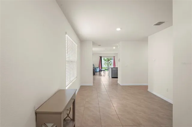 a kitchen with kitchen island a sink stainless steel appliances and cabinets