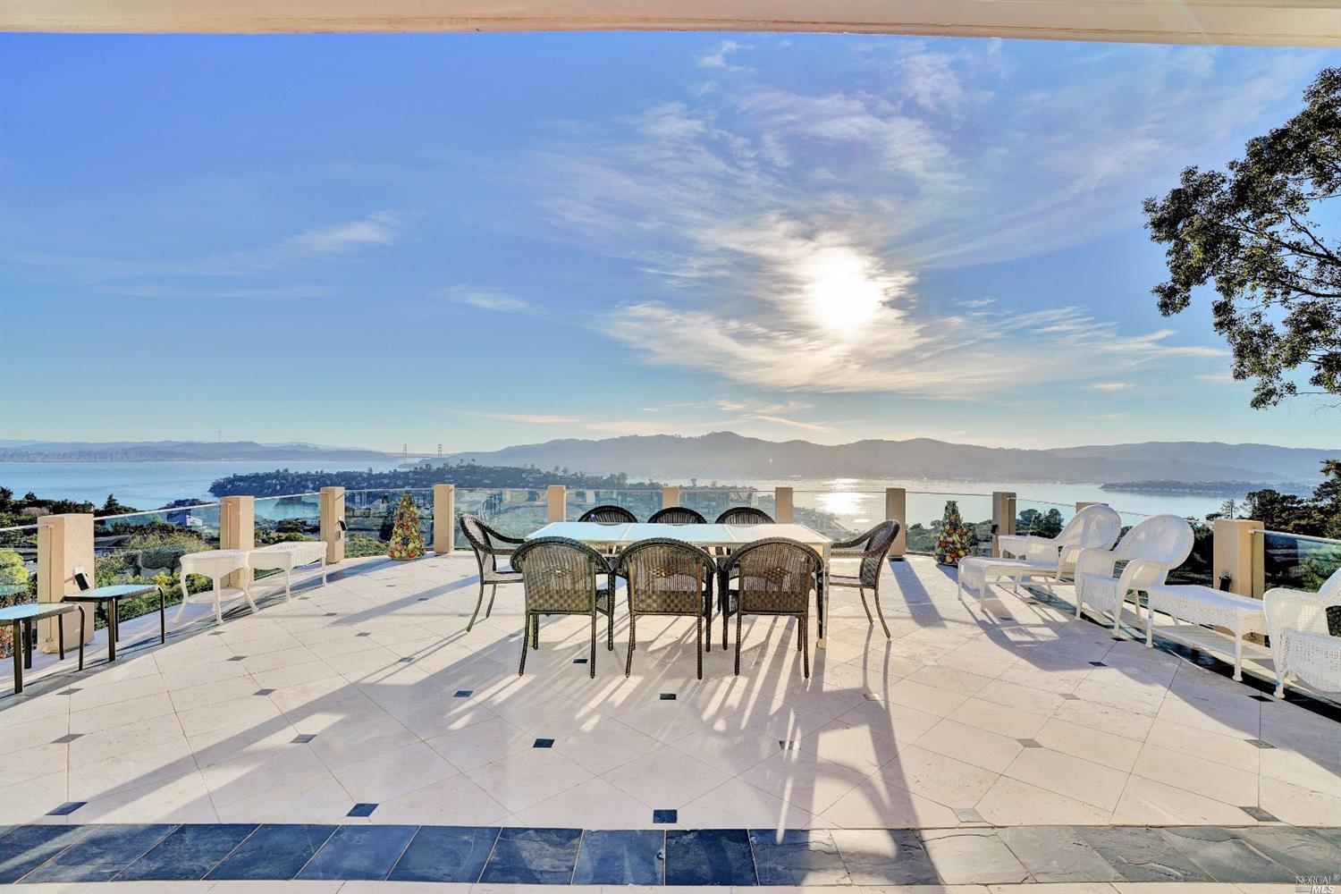 a view of a swimming pool with an outdoor seating
