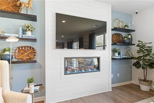 a living room with furniture and potted plant