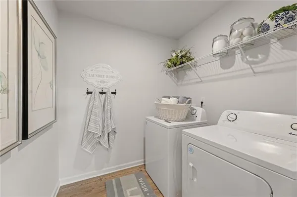 a view of storage and utility room with washer and dryer