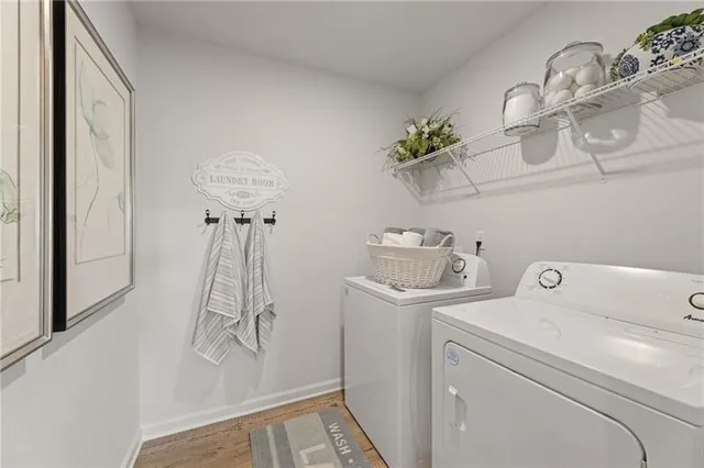 a view of storage and utility room with washer and dryer