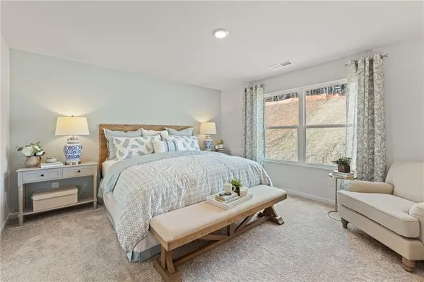 a bed room with a bed and a couch