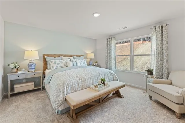 a bed room with a bed and a couch