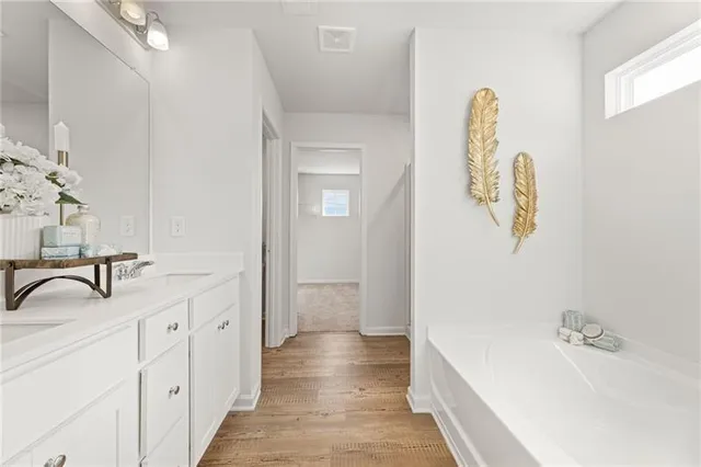 a bathroom with a sink and mirror