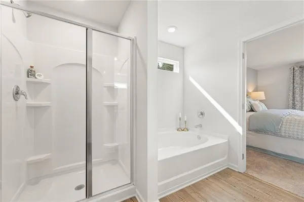 a bathroom with a bathtub and a shower