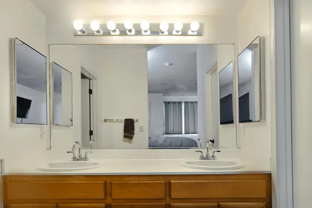 a bathroom with a sink and a mirror