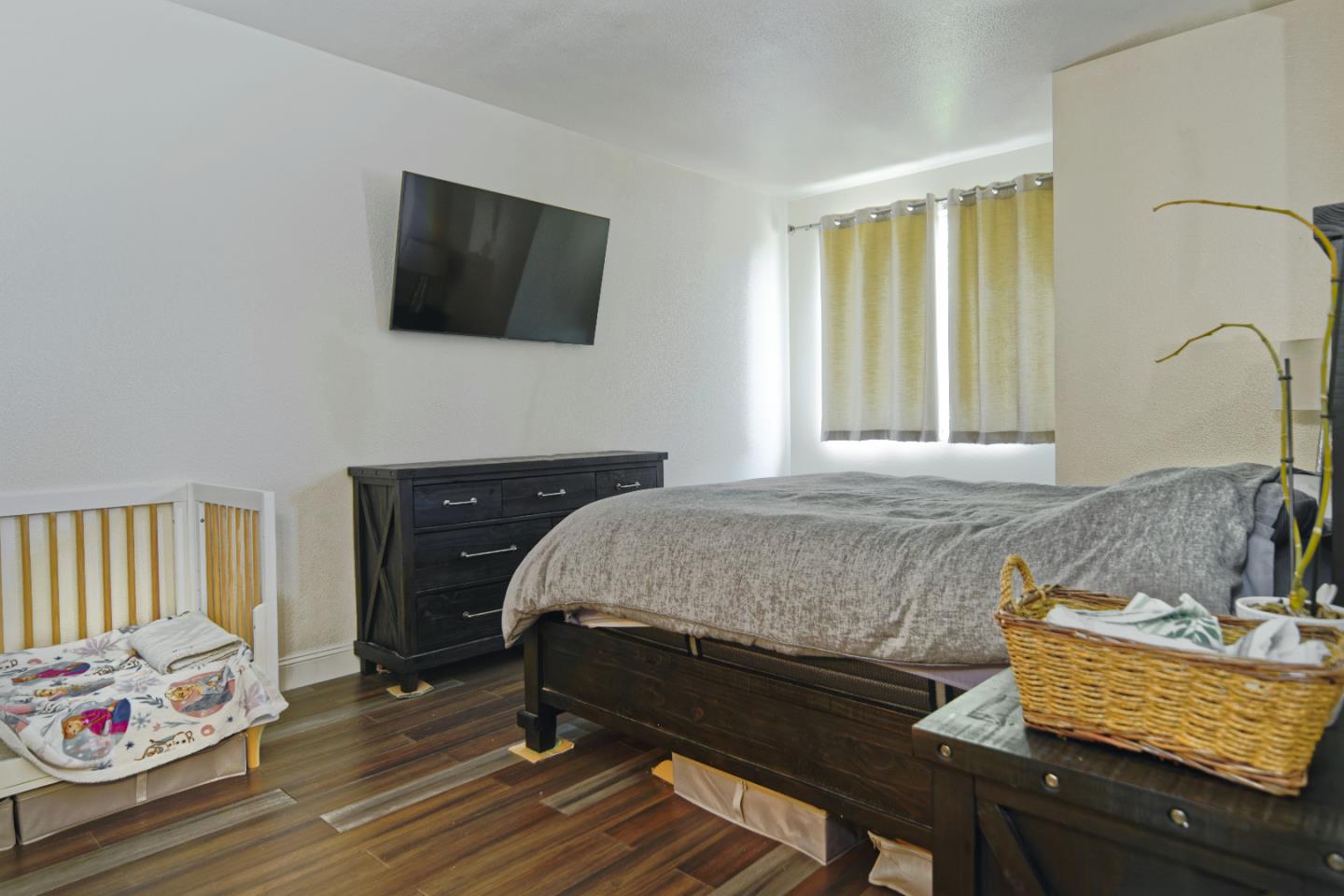 1021 Chagall Way San Jose, CA 95138 - Photo 22 of 25 a spacious bedroom with a bed and flat screen tv