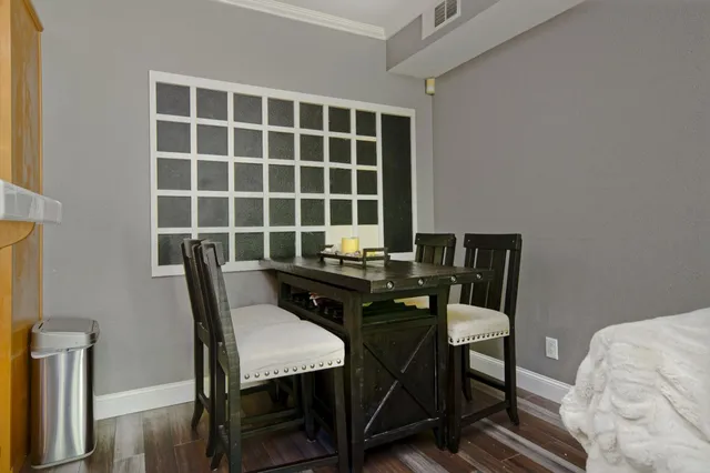 a view of a workspace with furniture and a bookshelf