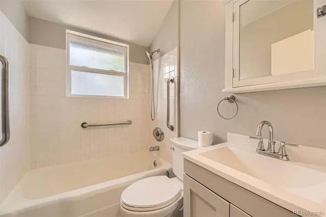 a bathroom with a sink a toilet and a bathtub