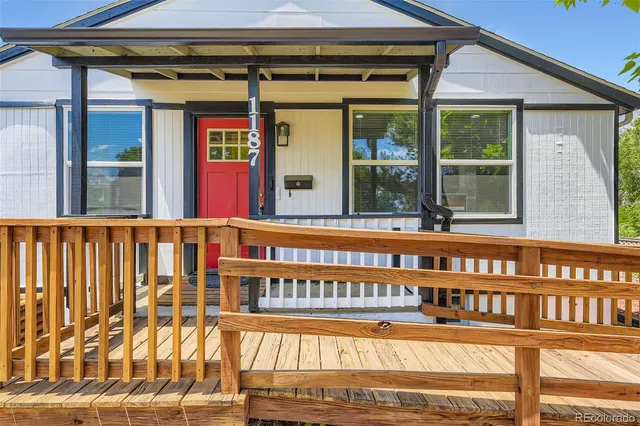 front view of a house with a large window