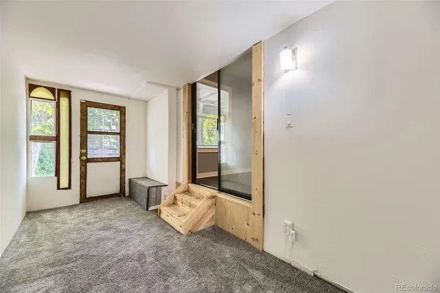 a view of an empty room and window