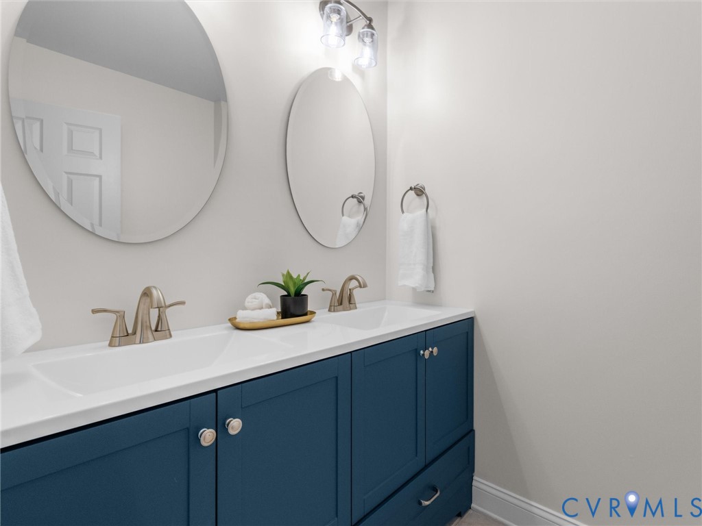14335 Lander Road Midlothian, VA 23113 - Photo 48 of 70 a bathroom with a sink and a mirror