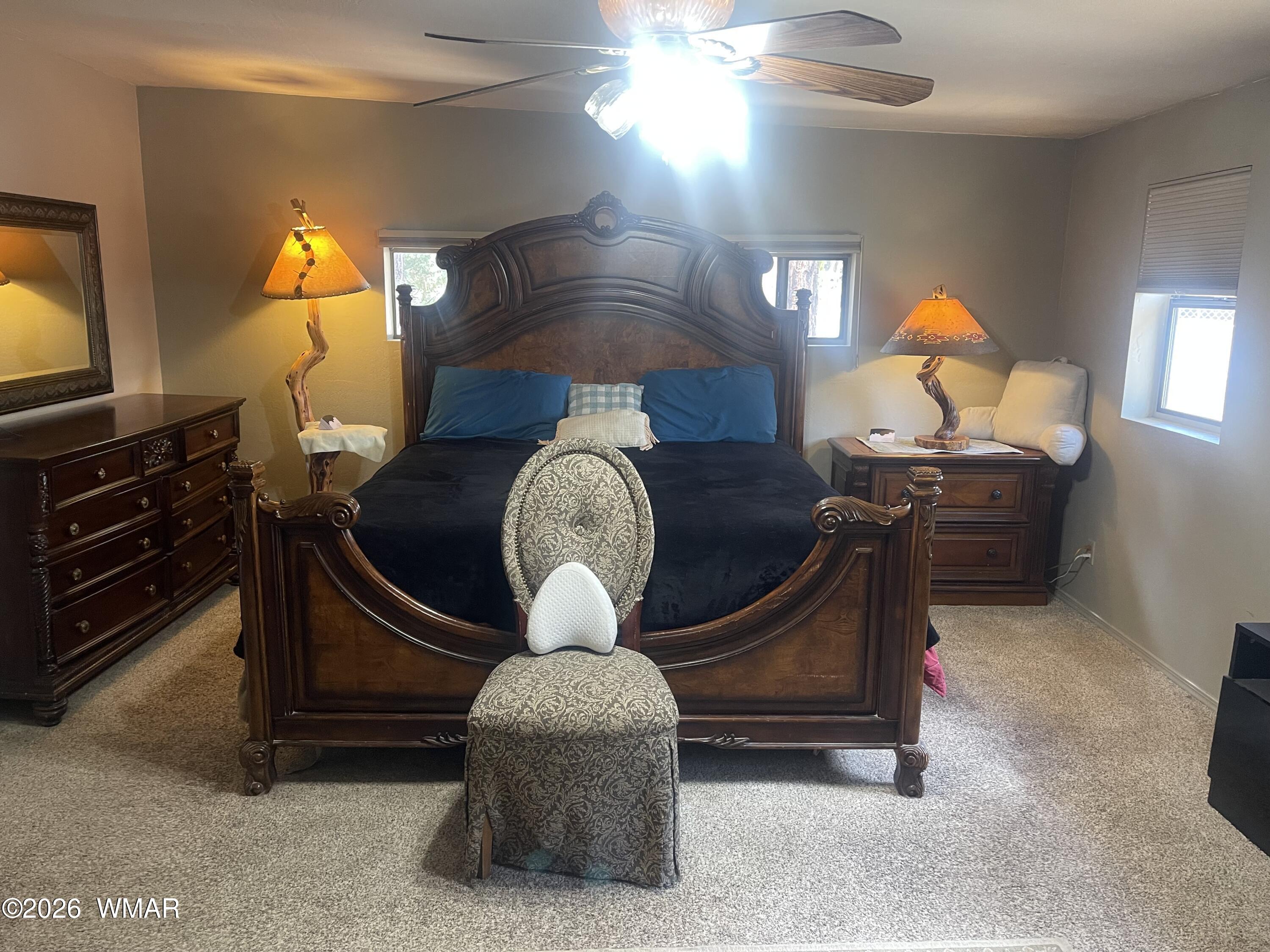 2871 Moose Trail Overgaard, AZ 85933 - Photo 15 of 25 a living room with furniture a lamp and a flat screen tv