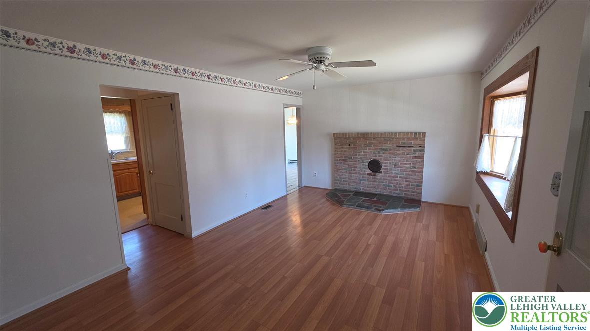 522 Rentzheimer Drive Hellertown, PA 18055 - Photo 23 of 57 a view of an empty room with wooden floor and a window