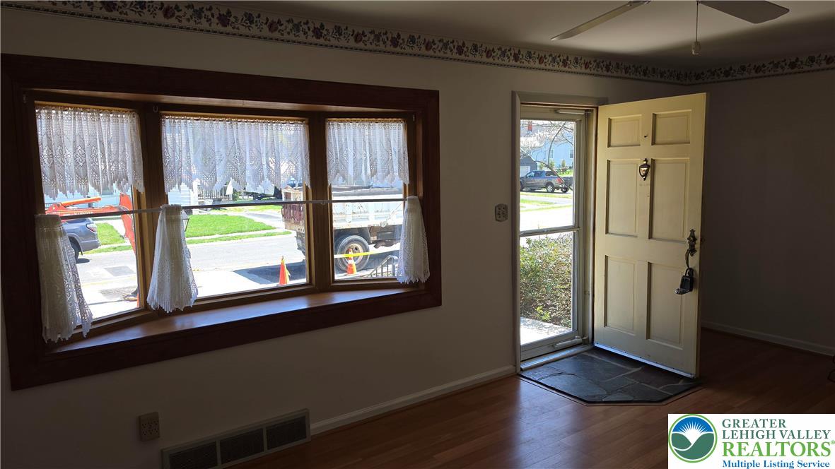 522 Rentzheimer Drive Hellertown, PA 18055 - Photo 24 of 57 a view of an empty room with wooden floor and a window