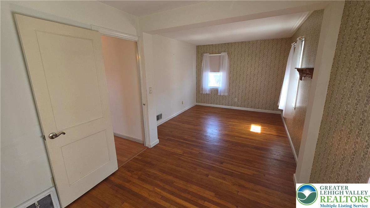 522 Rentzheimer Drive Hellertown, PA 18055 - Photo 40 of 57 a view of a hallway with wooden floor and staircase
