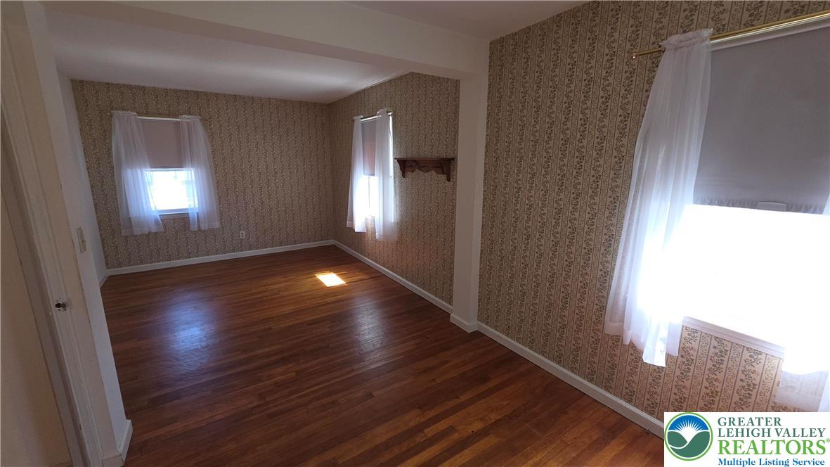 522 Rentzheimer Drive Hellertown, PA 18055 - Photo 41 of 57 a view of an empty room with wooden floor and a window