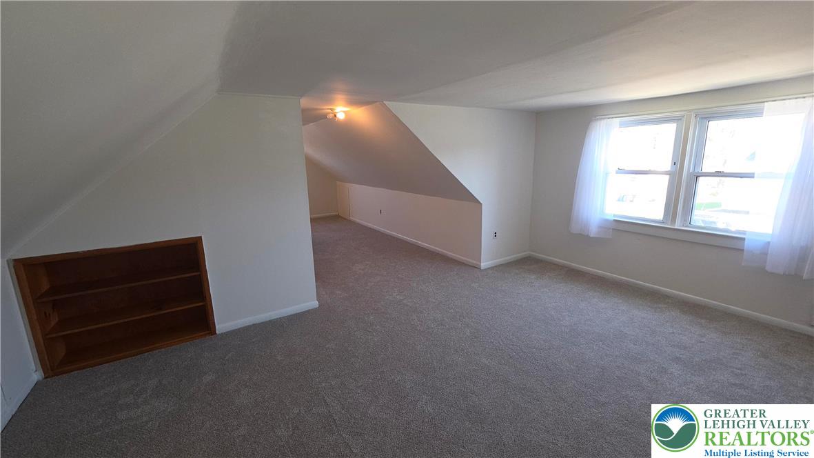 522 Rentzheimer Drive Hellertown, PA 18055 - Photo 47 of 57 an empty room with windows and cabinet