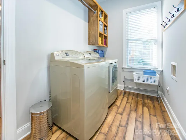 a utility room with a window dryer and washer