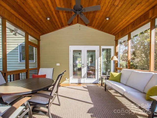a outdoor space with patio the couches and a dining table with the view of kitchen