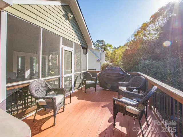 a view of a patio with table and chairs and potted plants