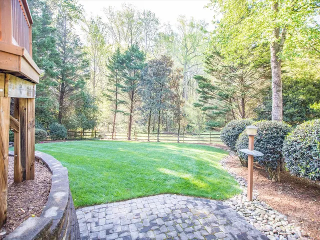 a view of a park with large trees
