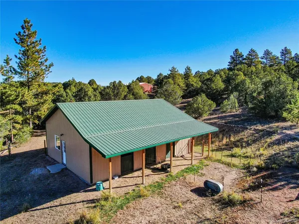 a aerial view of a house with a yard