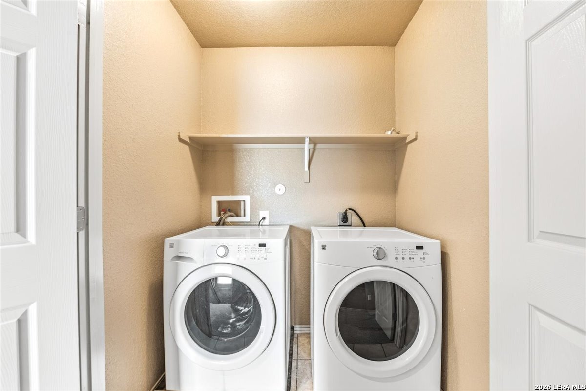 3831 Bacall Way Converse, TX 78109 - Photo 26 of 33 a utility room with dryer and washer
