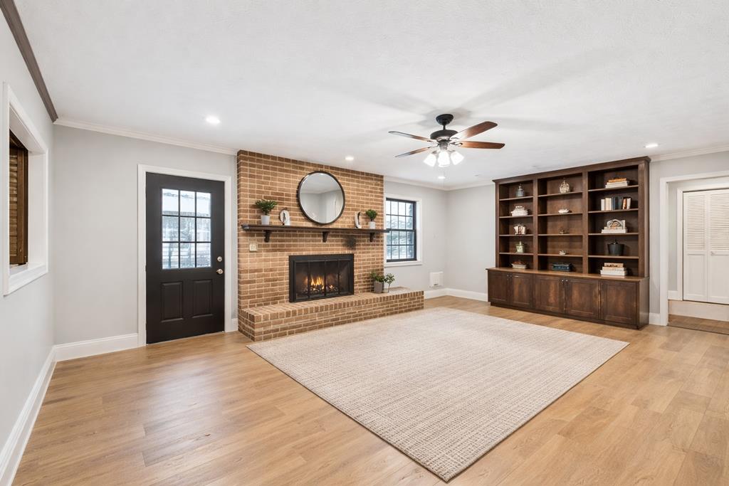 233 Ga Highway Fortson, GA 31808 - Photo 15 of 74 an empty room with windows and fireplace