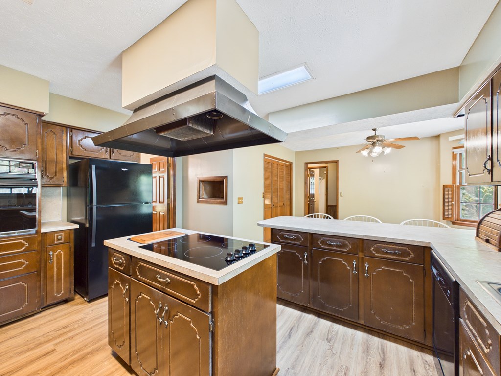 233 Ga Highway Fortson, GA 31808 - Photo 22 of 74 a kitchen with stainless steel appliances granite countertop a sink and a refrigerator