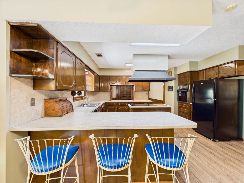 233 Ga Highway Fortson, GA 31808 - Photo 23 of 74 a kitchen with stainless steel appliances a table chairs and chandelier