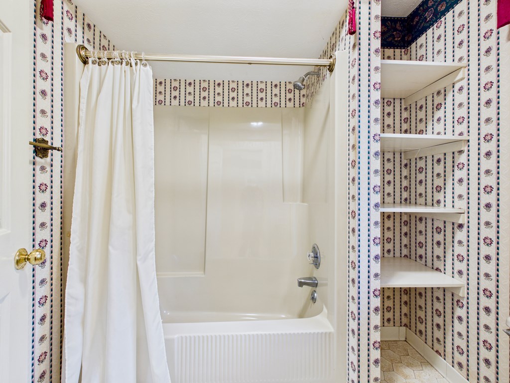 233 Ga Highway Fortson, GA 31808 - Photo 33 of 74 a bathroom with a shower and a bath tub