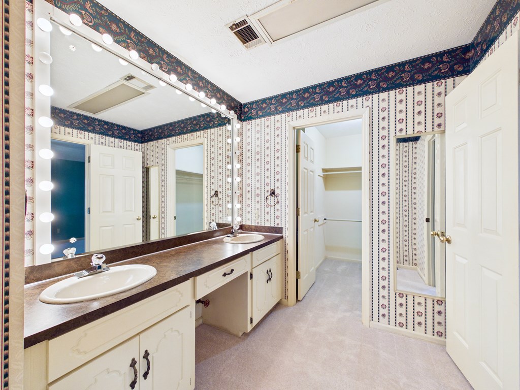233 Ga Highway Fortson, GA 31808 - Photo 35 of 74 a bathroom with a double vanity sink and mirror with shower