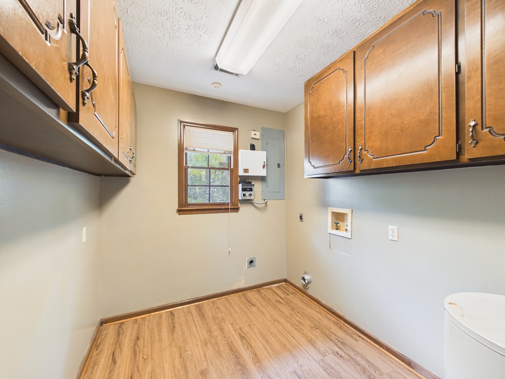 233 Ga Highway Fortson, GA 31808 - Photo 43 of 74 a view of an empty room with wooden floor and a window