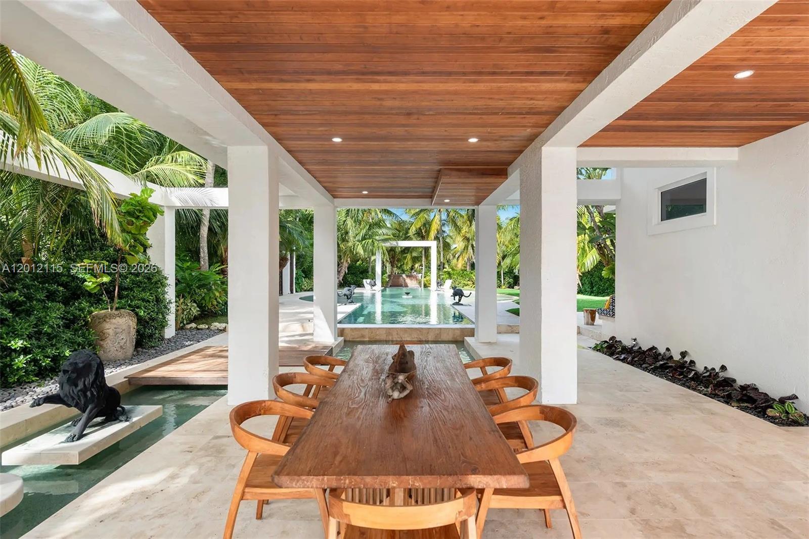 60 Ocean Front Drive Key Largo, FL 33037 - Photo 13 of 85 a outdoor dining space with furniture and garden view