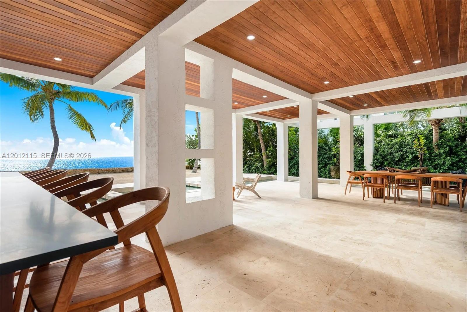 60 Ocean Front Drive Key Largo, FL 33037 - Photo 15 of 85 a living room with furniture and a large window