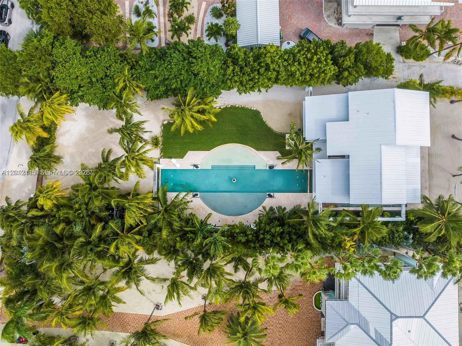 60 Ocean Front Drive Key Largo, FL 33037 - Photo 24 of 85 an aerial view of a house with a yard
