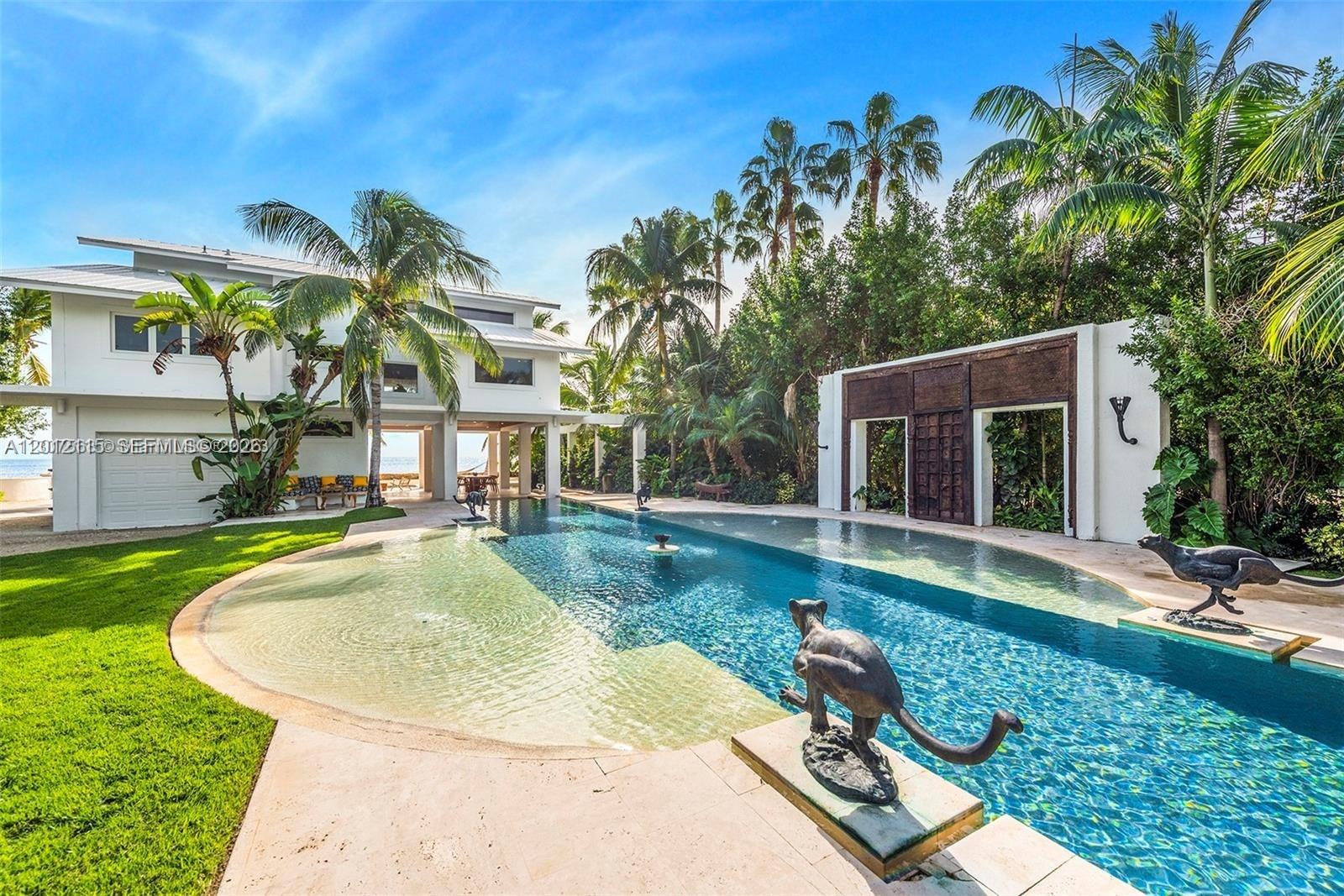 60 Ocean Front Drive Key Largo, FL 33037 - Photo 27 of 85 a view of a house with swimming pool and sitting area