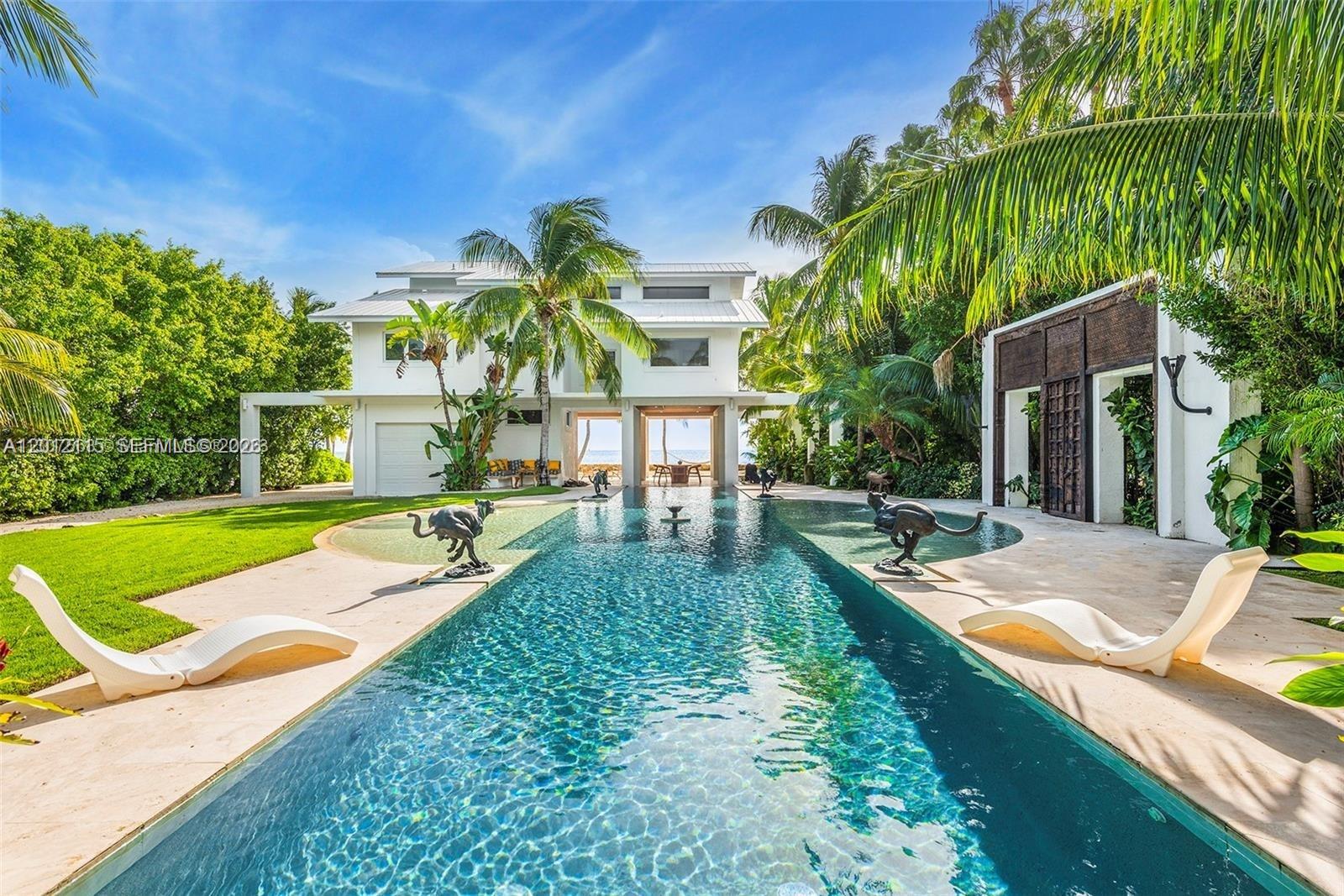 60 Ocean Front Drive Key Largo, FL 33037 - Photo 31 of 85 a view of a house with swimming pool and sitting area
