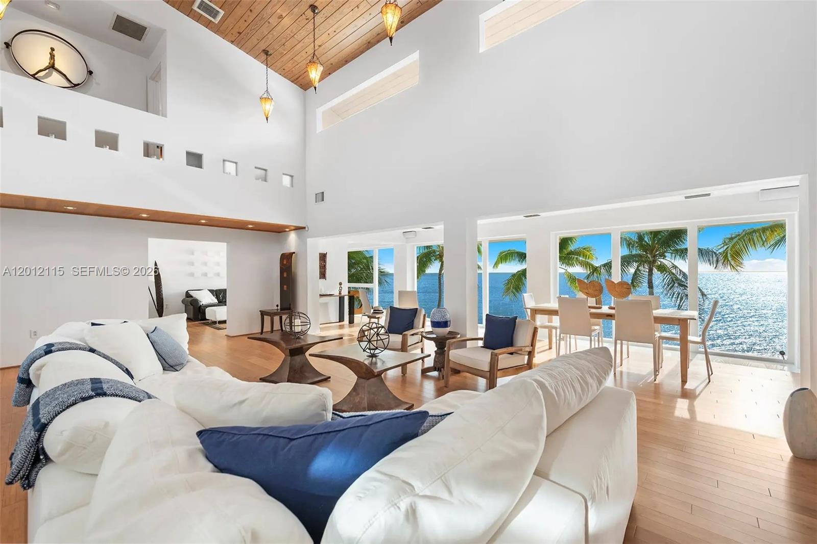 60 Ocean Front Drive Key Largo, FL 33037 - Photo 40 of 85 a living room with furniture and a large window