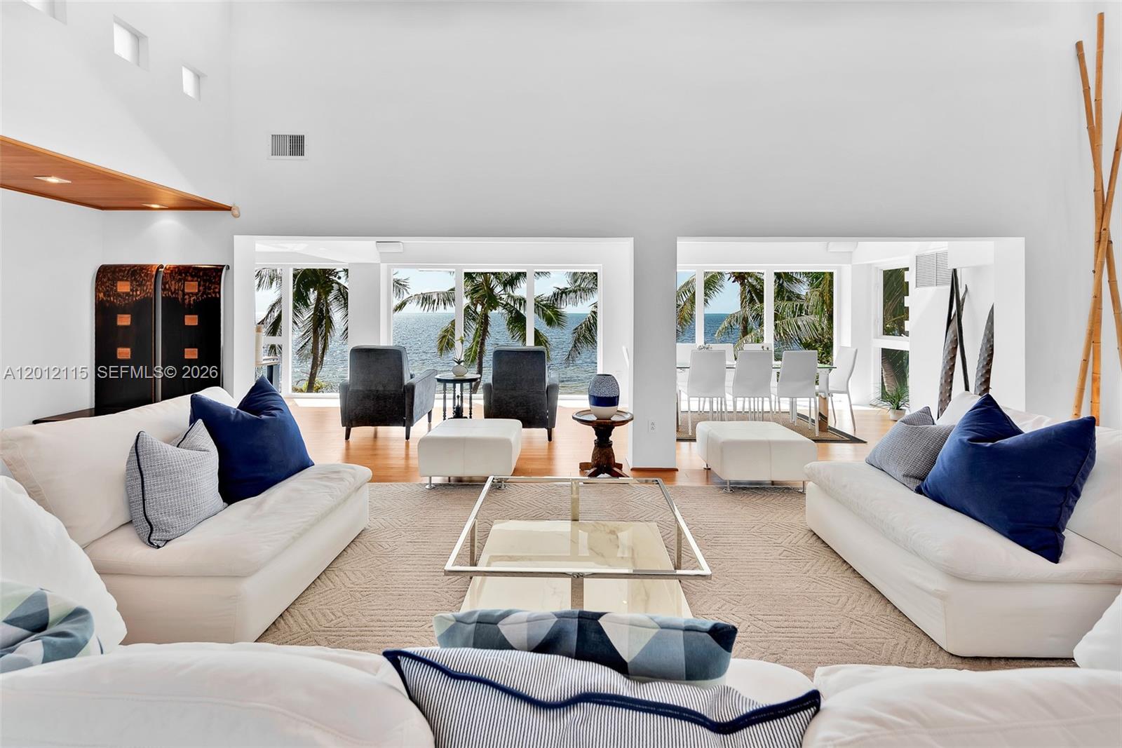 60 Ocean Front Drive Key Largo, FL 33037 - Photo 42 of 85 a living room with furniture and a large window