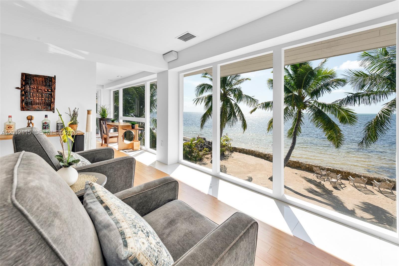 60 Ocean Front Drive Key Largo, FL 33037 - Photo 47 of 85 a living room with furniture and a large window